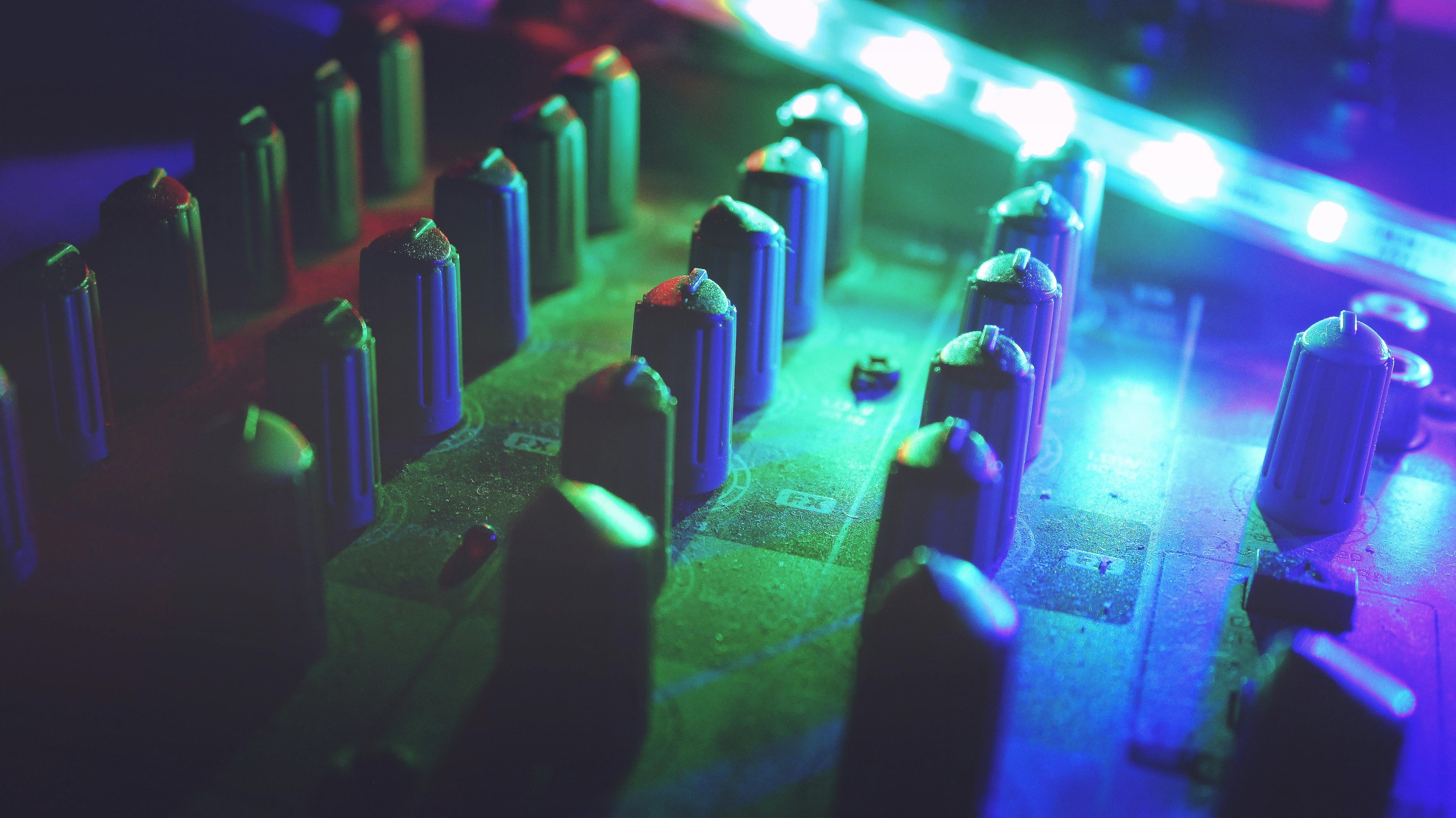 Close-up of electronic equipment with colorful LED lights